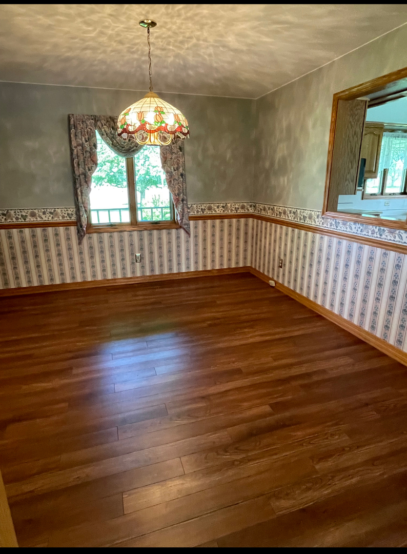 1685 West Mine Road Mazon, IL 60444 - Photo 34 of 48 a view of a room with wooden floor and windows