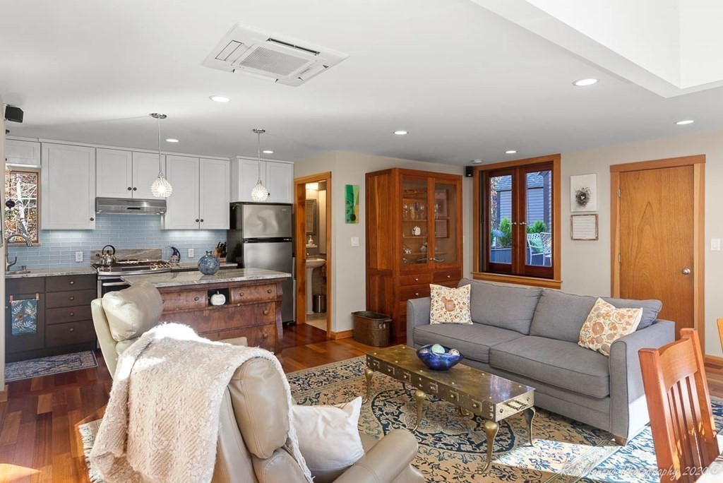 38 Boston Road Newbury, MA 01951 - Photo 5 of 42 a living room with stainless steel appliances kitchen island granite countertop furniture and a view of kitchen