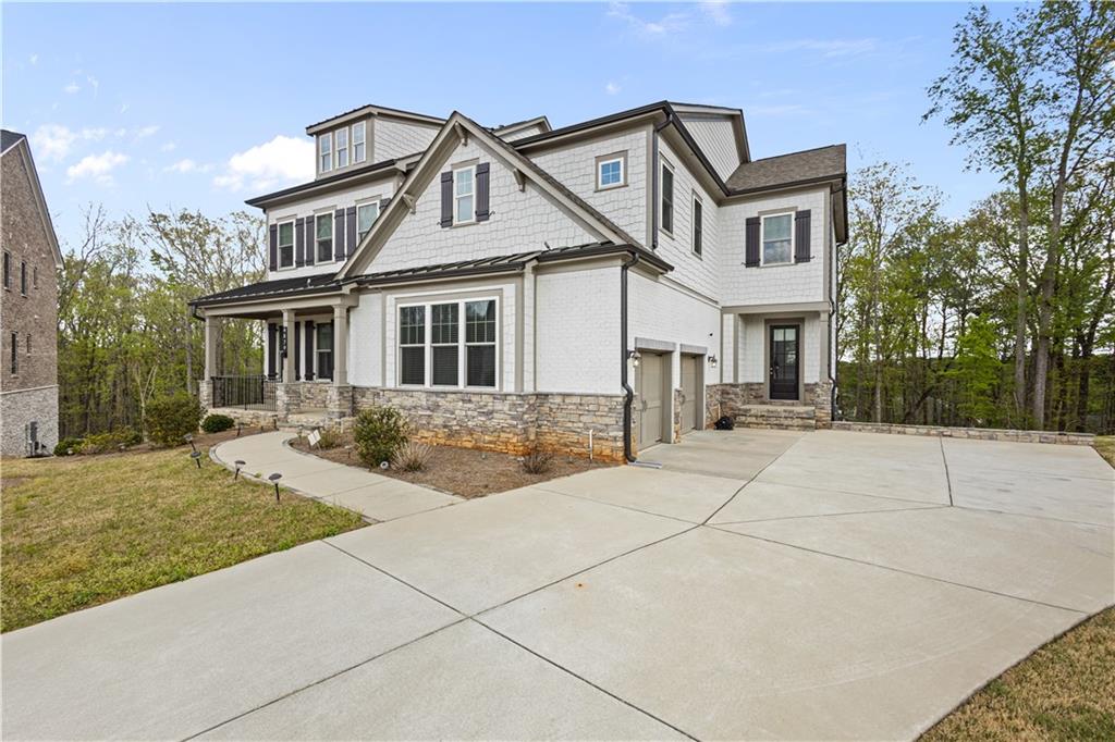 4879 Glencree Court Southwest Powder Springs, GA 30127 - Photo 3 of 47 a front view of a house with a yard