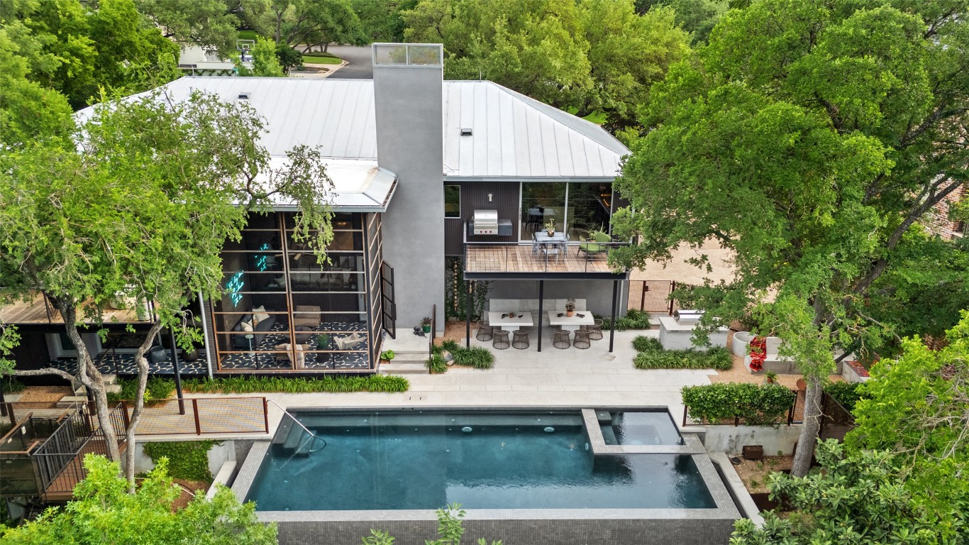 2908 Scenic Drive Austin, TX 78703 - Photo 1 of 40 a view of house with swimming pool outdoor seating area and plants