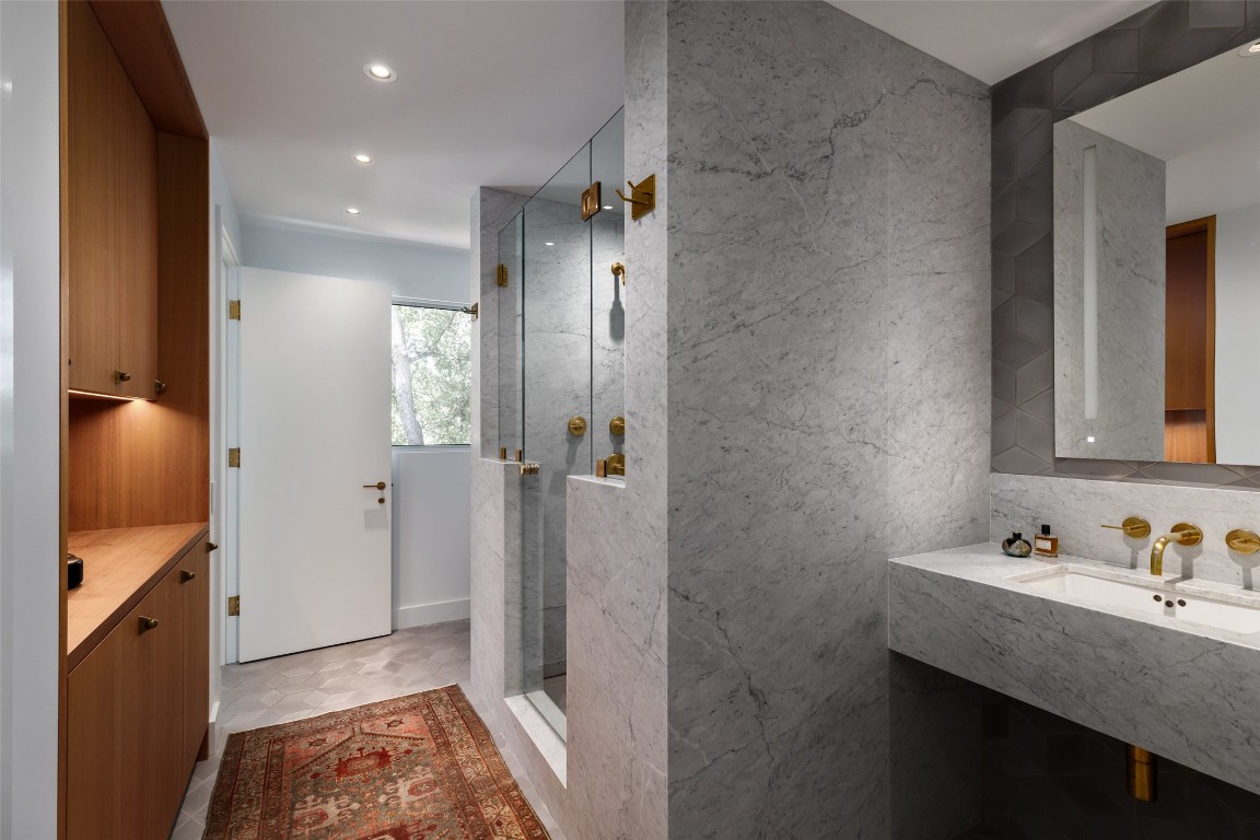 2908 Scenic Drive Austin, TX 78703 - Photo 25 of 40 a bathroom with a granite countertop sink and a mirror