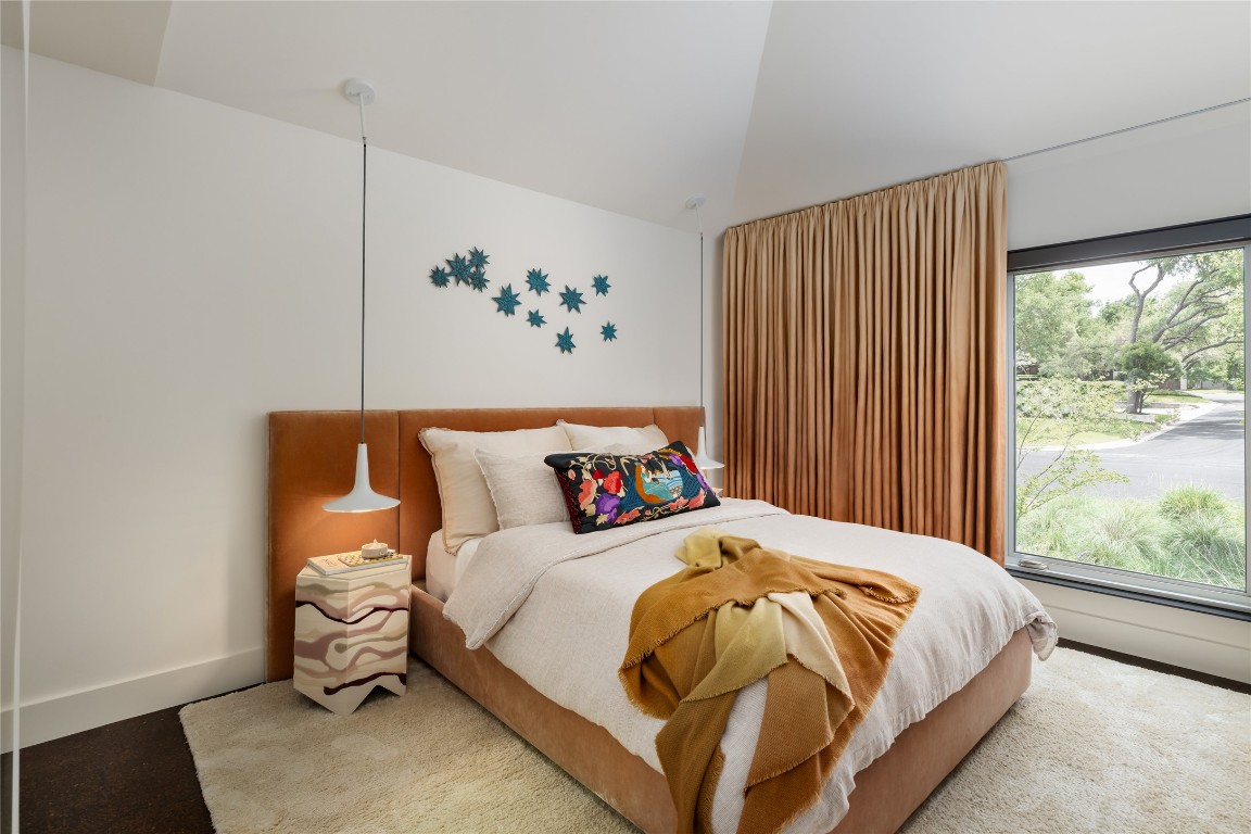 2908 Scenic Drive Austin, TX 78703 - Photo 27 of 40 a bedroom with a large bed and a window