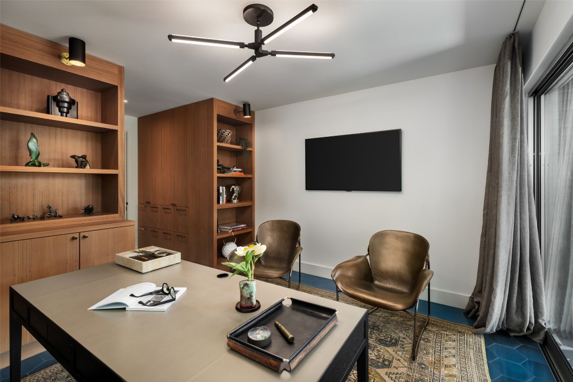 2908 Scenic Drive Austin, TX 78703 - Photo 29 of 40 a view of a workspace with furniture and wooden floor