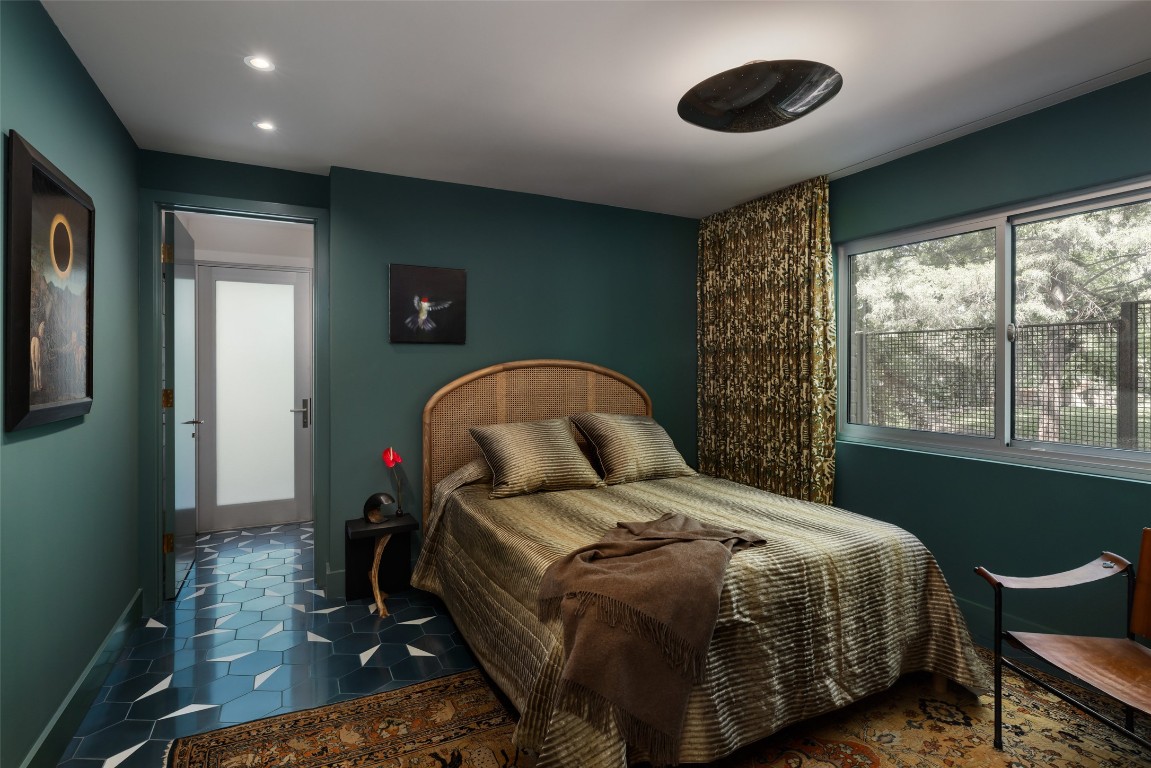 2908 Scenic Drive Austin, TX 78703 - Photo 30 of 40 a bedroom with a bed and a large window