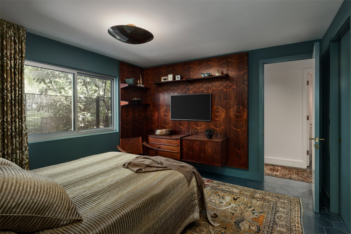 2908 Scenic Drive Austin, TX 78703 - Photo 31 of 40 a bedroom with a bed and a television