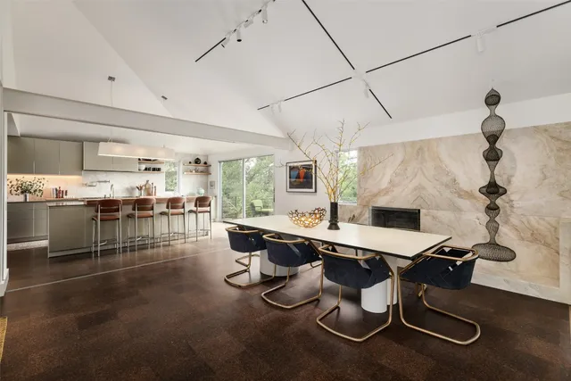 a room with gym equipment and large windows