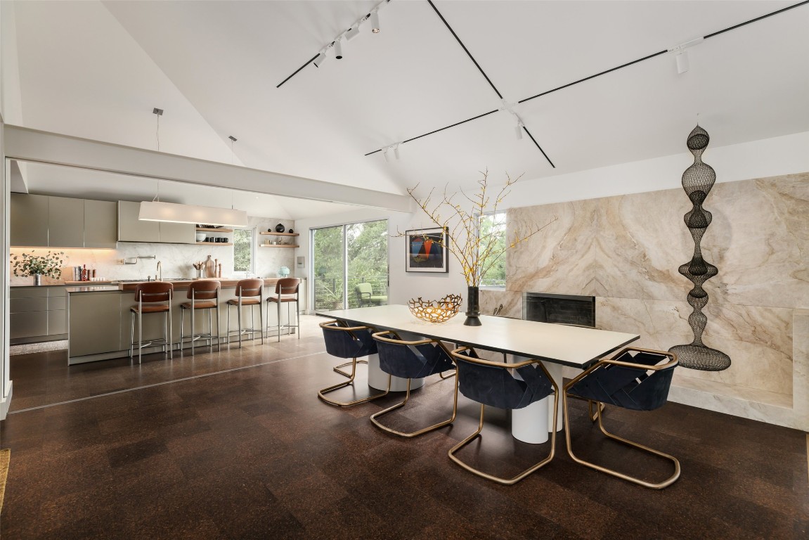 2908 Scenic Drive Austin, TX 78703 - Photo 6 of 40 a room with stainless steel appliances kitchen island granite countertop a table chairs in it and wooden floors