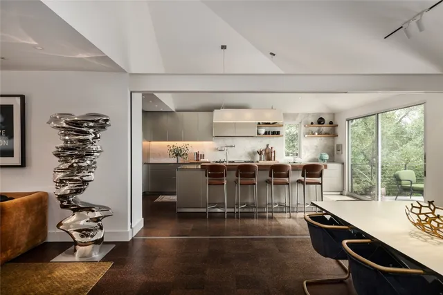 a kitchen that has a sink and a stove in it