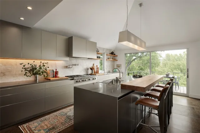 a kitchen with a stove and a refrigerator