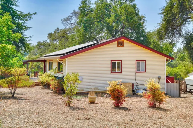a swimming pool with outdoor seating and yard