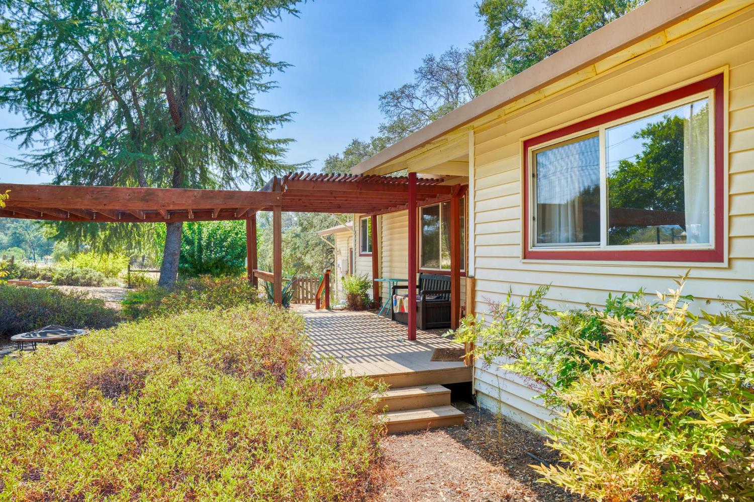 18490 Railbed Road Jamestown, CA 95327 - Photo 12 of 53 a swimming pool with outdoor seating and yard