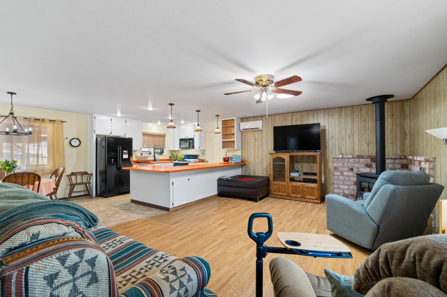 18490 Railbed Road Jamestown, CA 95327 - Photo 17 of 53 a living room with furniture kitchen view and a flat screen tv