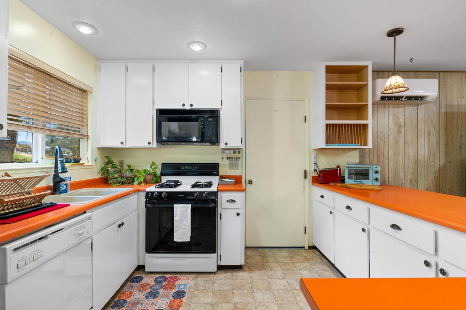 18490 Railbed Road Jamestown, CA 95327 - Photo 21 of 53 a kitchen with stainless steel appliances a stove a sink and a refrigerator
