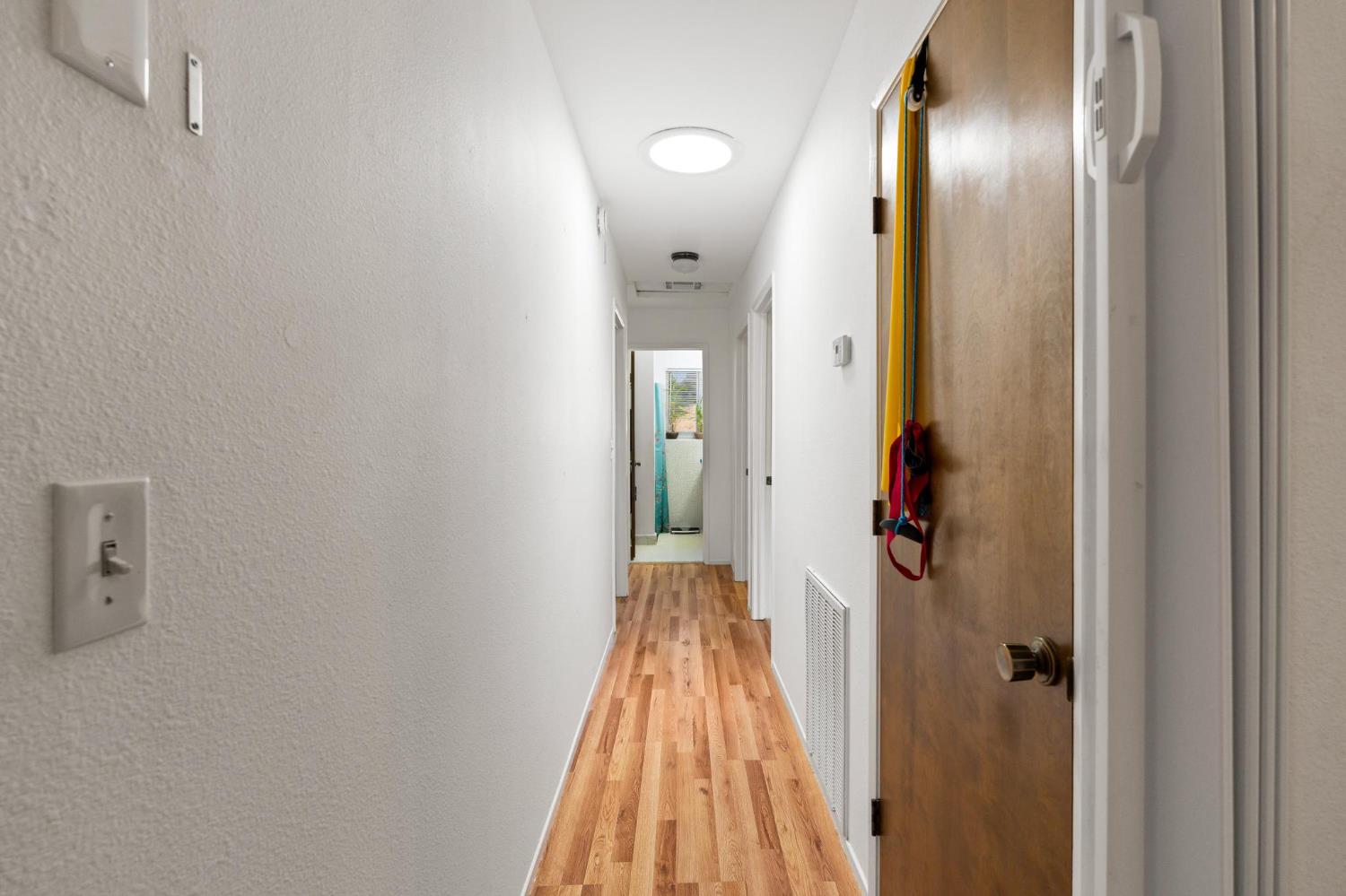 18490 Railbed Road Jamestown, CA 95327 - Photo 24 of 53 a view of a hallway with wooden floor