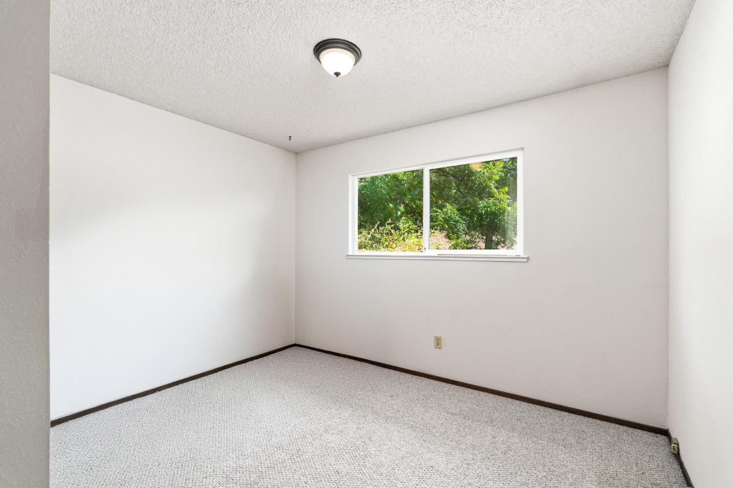 18490 Railbed Road Jamestown, CA 95327 - Photo 30 of 53 a view of an empty room with a window