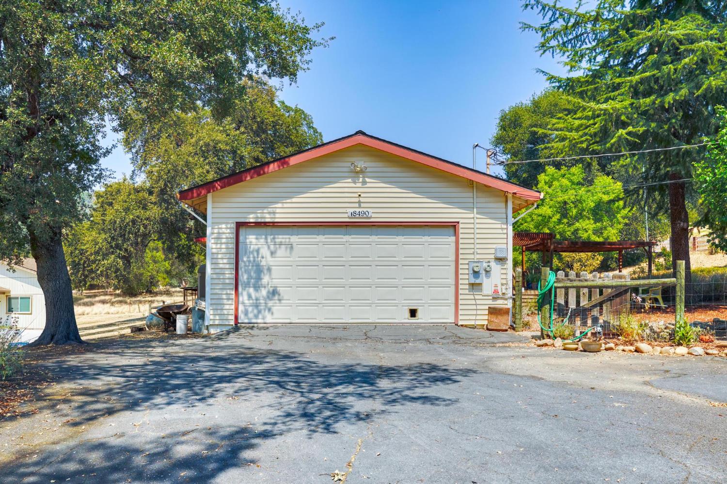 18490 Railbed Road Jamestown, CA 95327 - Photo 33 of 53 a view of a house with a yard and garage