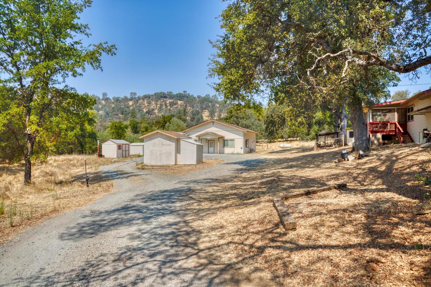18490 Railbed Road Jamestown, CA 95327 - Photo 34 of 53 a view of a house with a yard