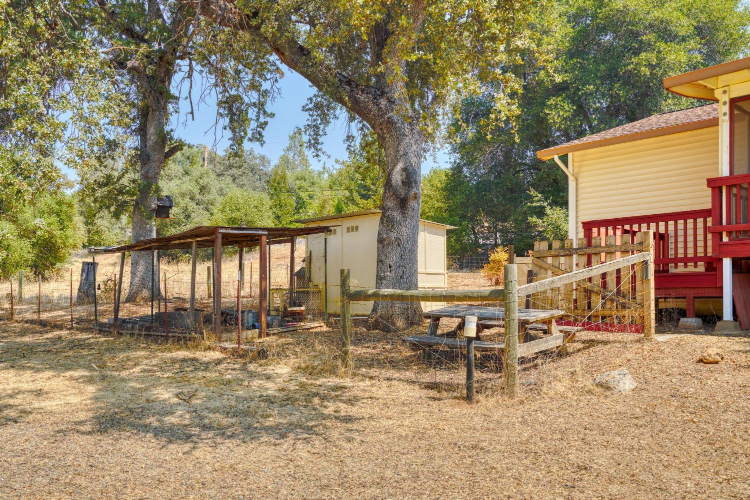 18490 Railbed Road Jamestown, CA 95327 - Photo 38 of 53 a view of a house with backyard and sitting area