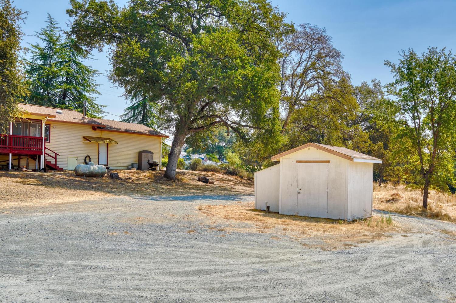 18490 Railbed Road Jamestown, CA 95327 - Photo 40 of 53 a view of a house with a yard and garage