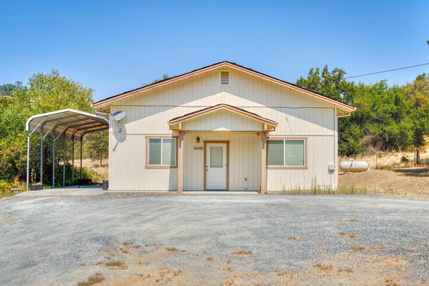 18490 Railbed Road Jamestown, CA 95327 - Photo 42 of 53 a front view of a house with a yard