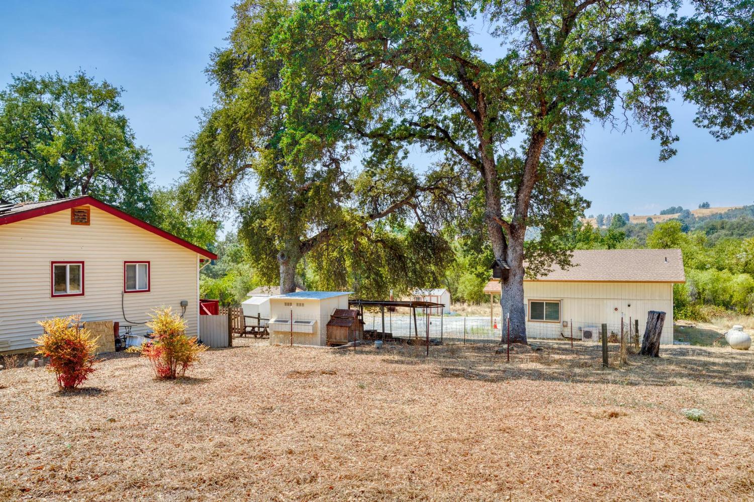 18490 Railbed Road Jamestown, CA 95327 - Photo 46 of 53 a view of a outdoor space with a patio and fire pit