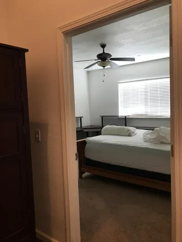 a kitchen with a sink cabinets and window