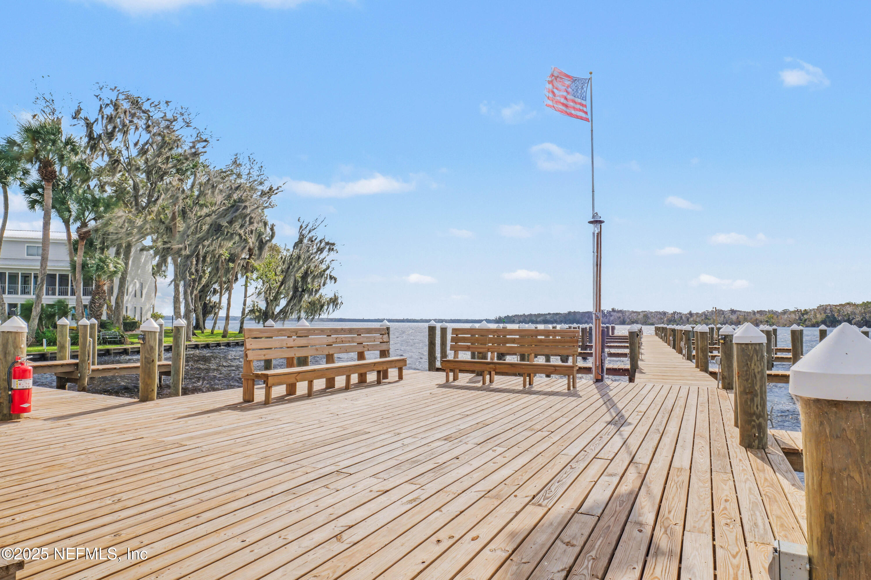 102 River Bend Road, Unit A Welaka, FL 32193 - Photo 15 of 39 a view of a terrace with wooden floor