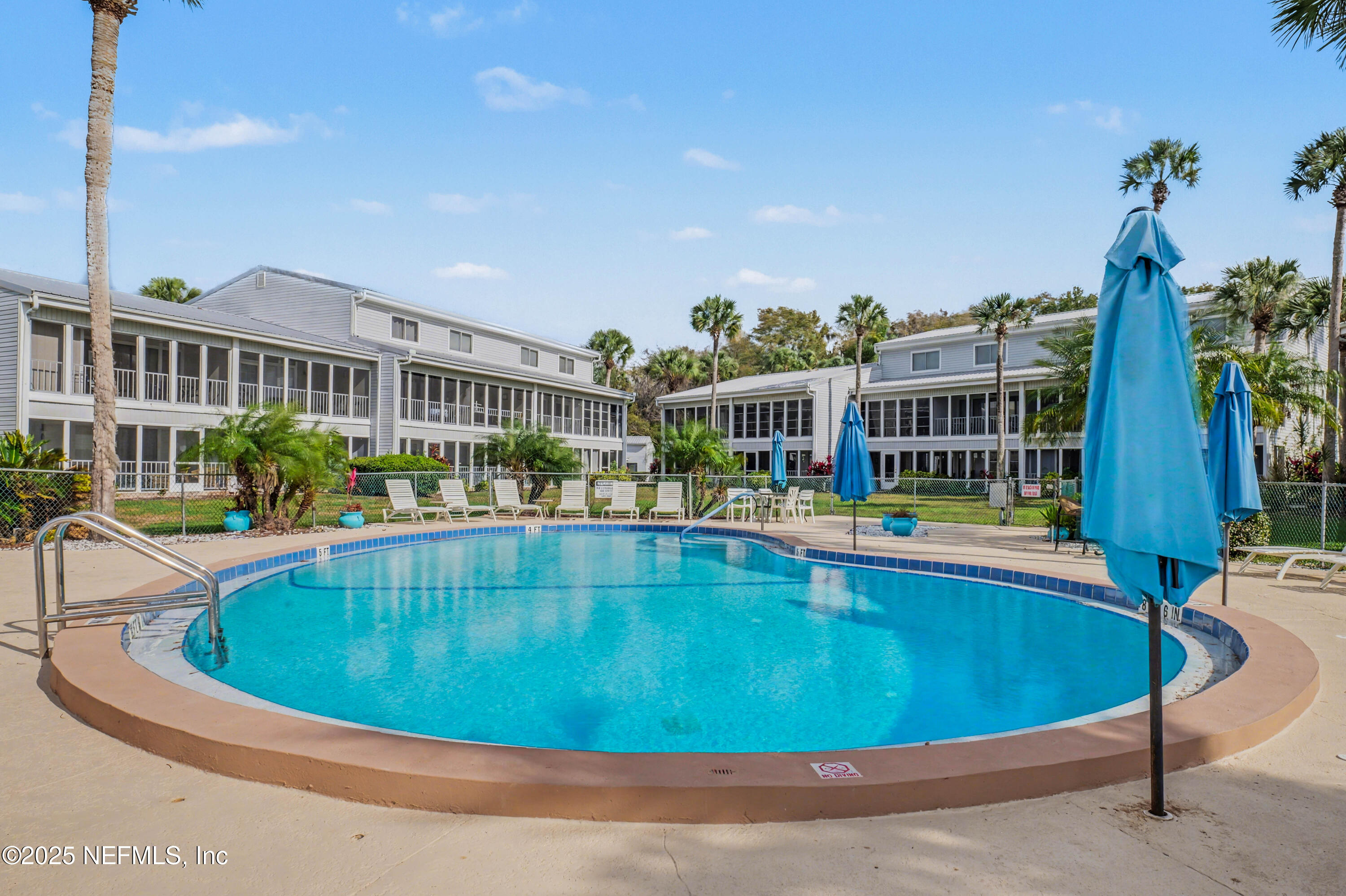 102 River Bend Road, Unit A Welaka, FL 32193 - Photo 18 of 39 a view of a swimming pool with a patio