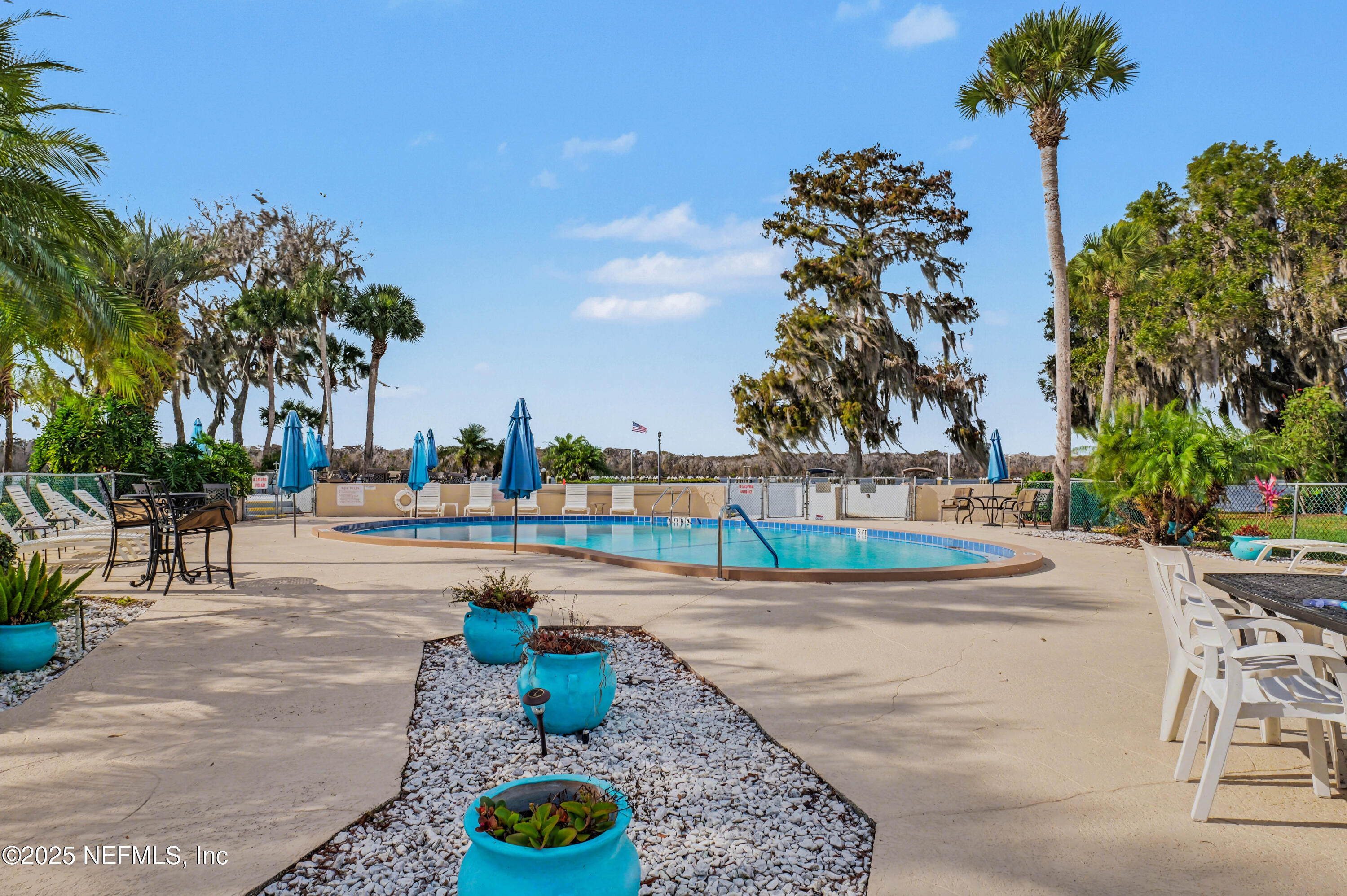 102 River Bend Road, Unit A Welaka, FL 32193 - Photo 19 of 39 a view of a terrace with a garden