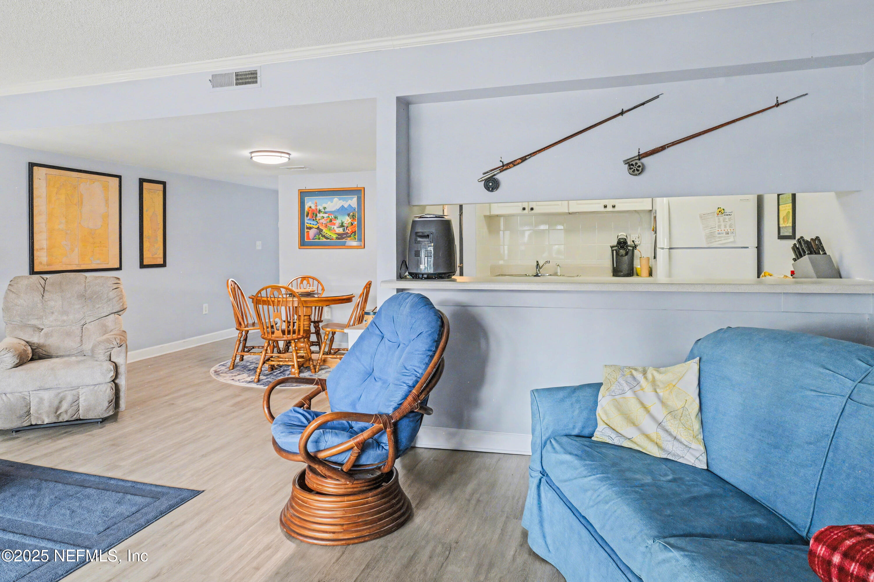 102 River Bend Road, Unit A Welaka, FL 32193 - Photo 24 of 39 a living room with furniture and wooden floor