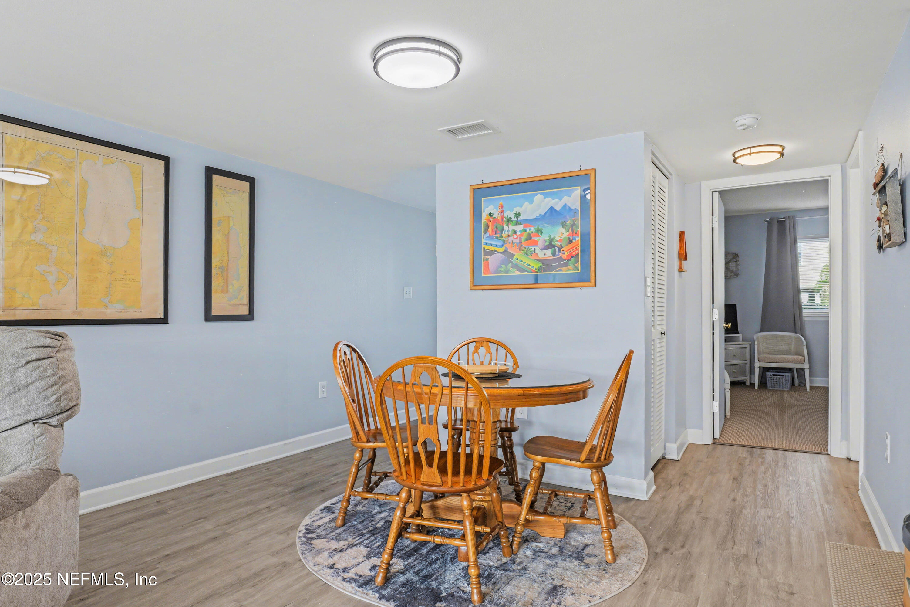 102 River Bend Road, Unit A Welaka, FL 32193 - Photo 28 of 39 a dining room with furniture and window