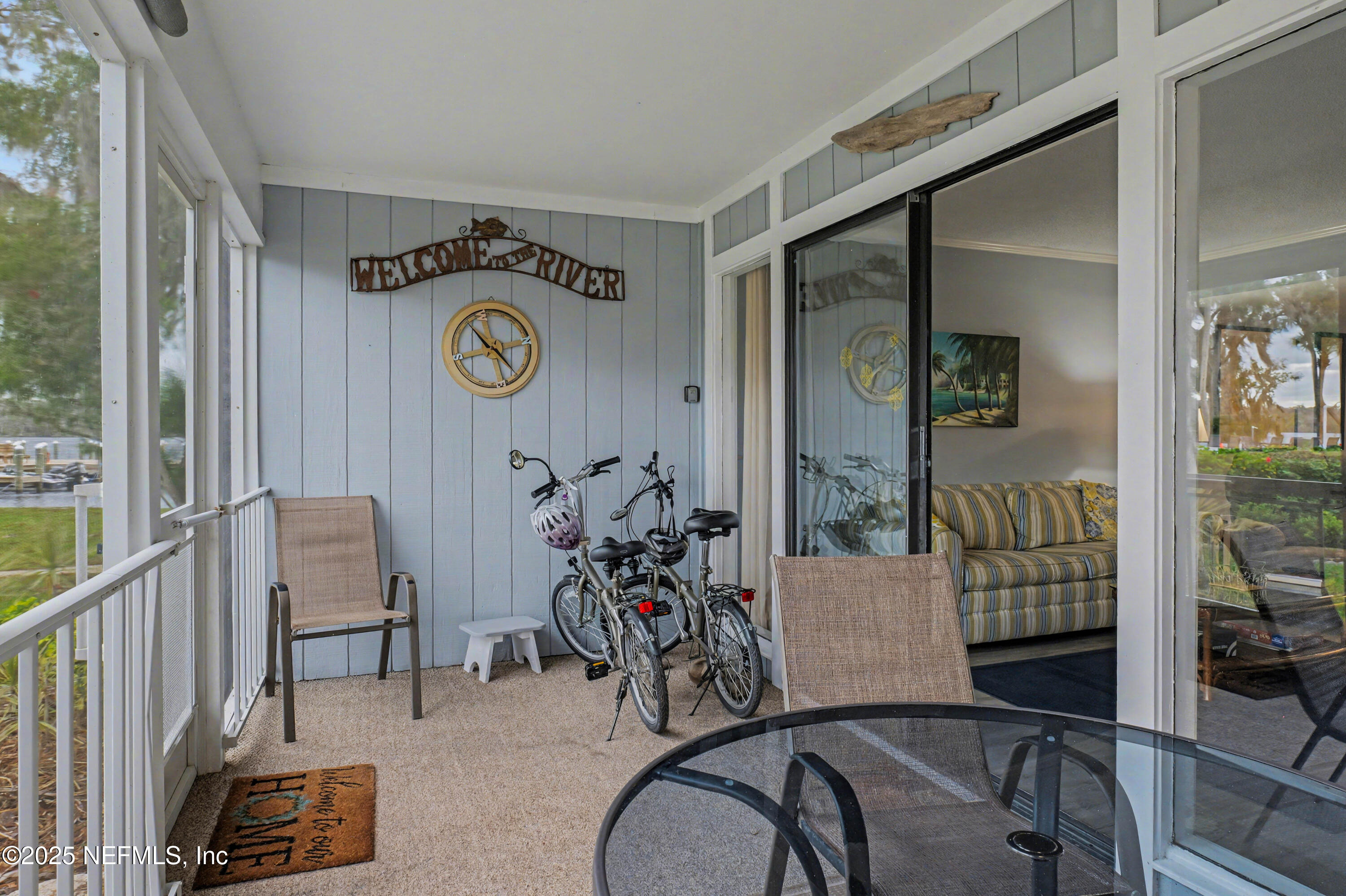 102 River Bend Road, Unit A Welaka, FL 32193 - Photo 38 of 39 a view of a hallway with workspace and living room