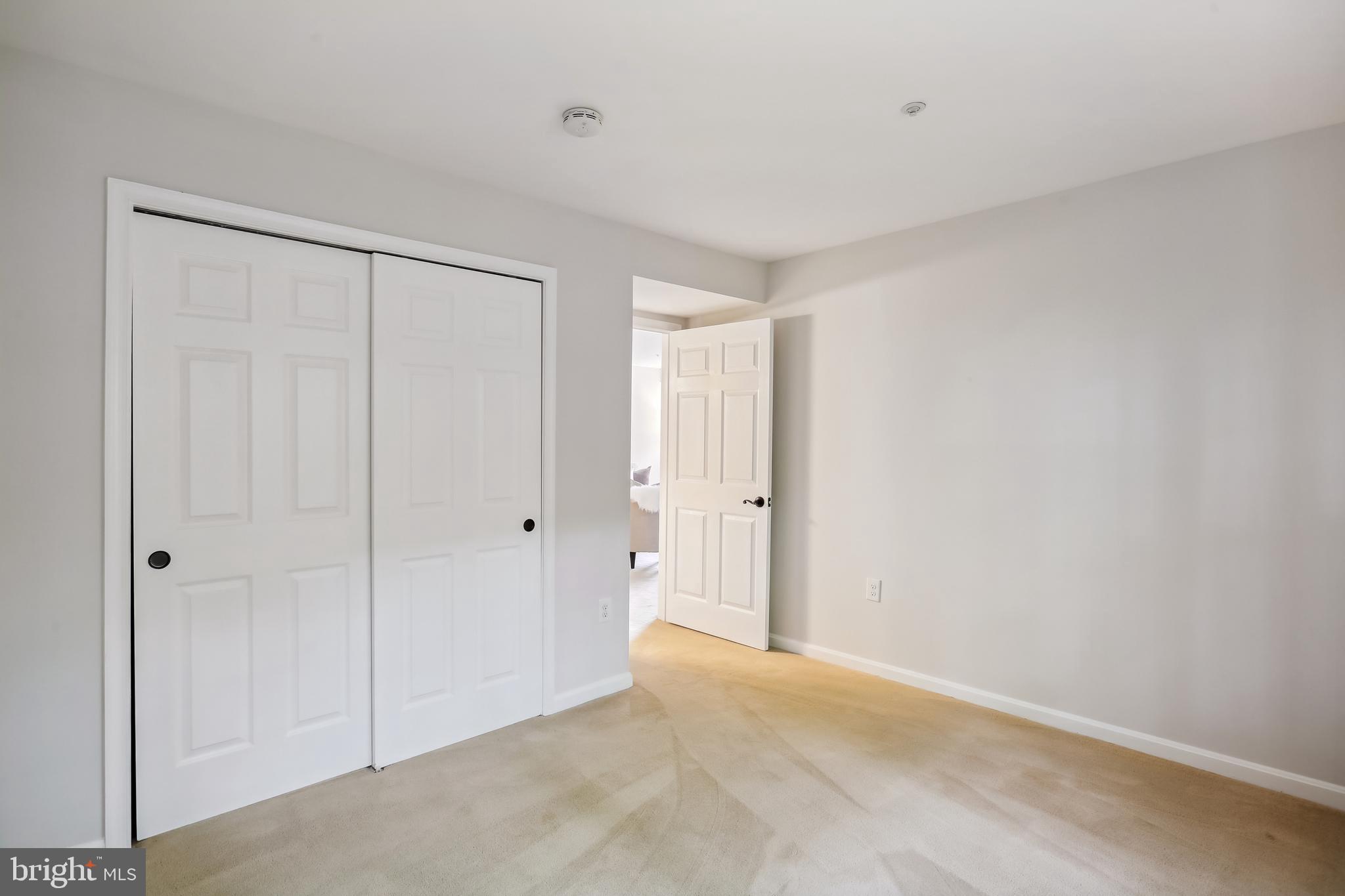 212 Ridgepoint Place, Unit 21218 Gaithersburg, MD 20878 - Photo 24 of 51 Second bedroom w/double-door closet