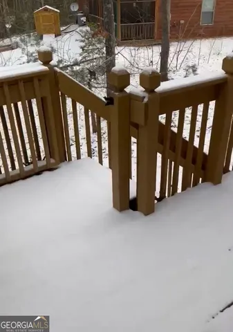 a view of wooden fence in front of house