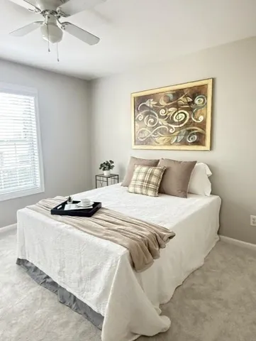 a bedroom with a bed and window