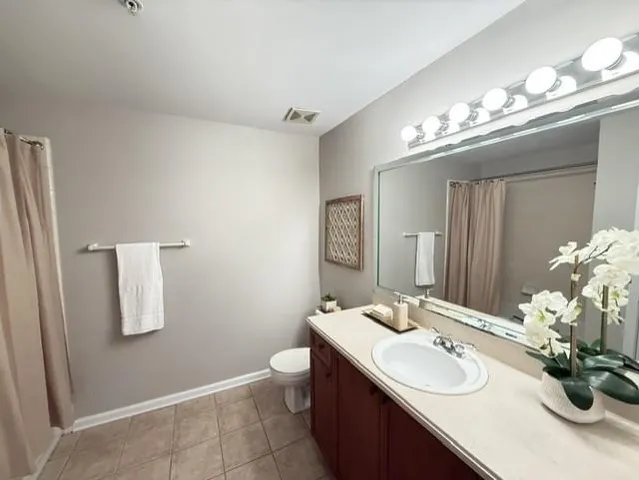 a bathroom with a sink double vanity and a mirror