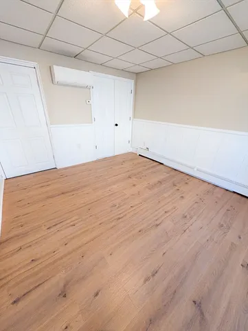 an empty room with wooden floor
