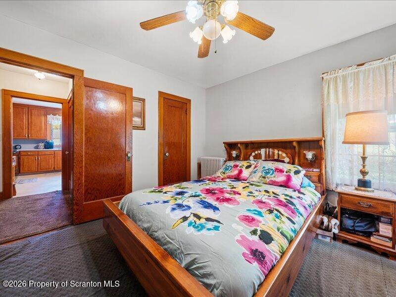 71 Pleasant Avenue Thompson, PA 18465 - Photo 14 of 37 a bedroom with a bed and a lamp