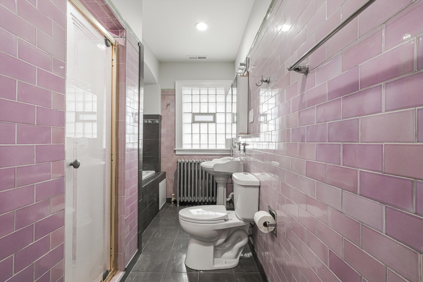 11340 South Union Avenue Chicago, IL 60628 - Photo 15 of 27 a bathroom with a toilet sink and mirror