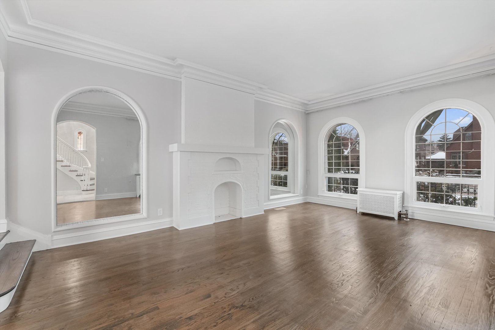 11340 South Union Avenue Chicago, IL 60628 - Photo 2 of 27 a view of an empty room with wooden floor and a window