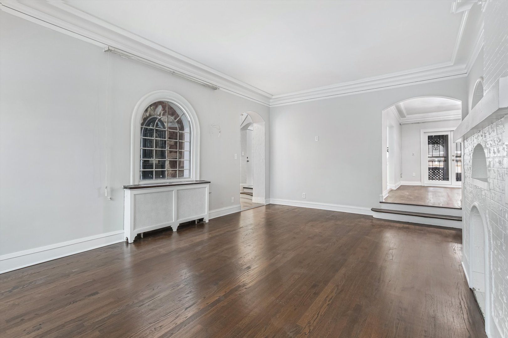 11340 South Union Avenue Chicago, IL 60628 - Photo 3 of 27 a view of empty room with wooden floor and fan