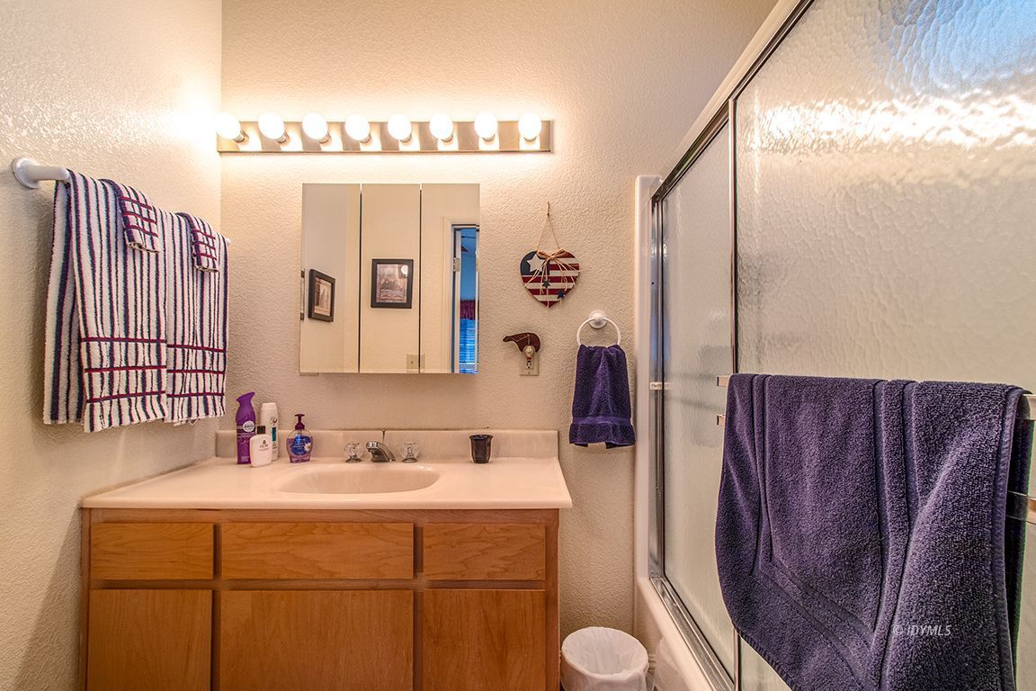 25244 Cougar Road Idyllwild, CA 92549 - Photo 1 of 32 a bathroom with a sink mirror vanity and toilet
