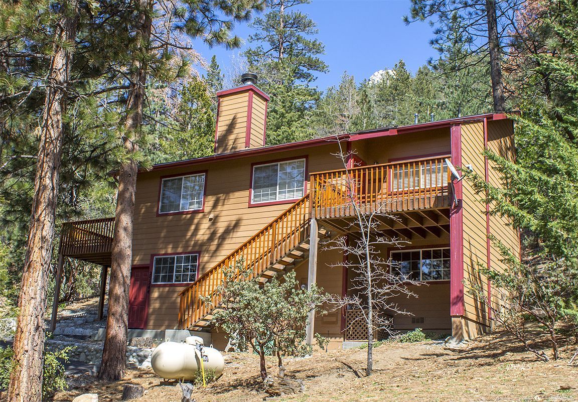 25244 Cougar Road Idyllwild, CA 92549 - Photo 3 of 32 a front view of a house with parking