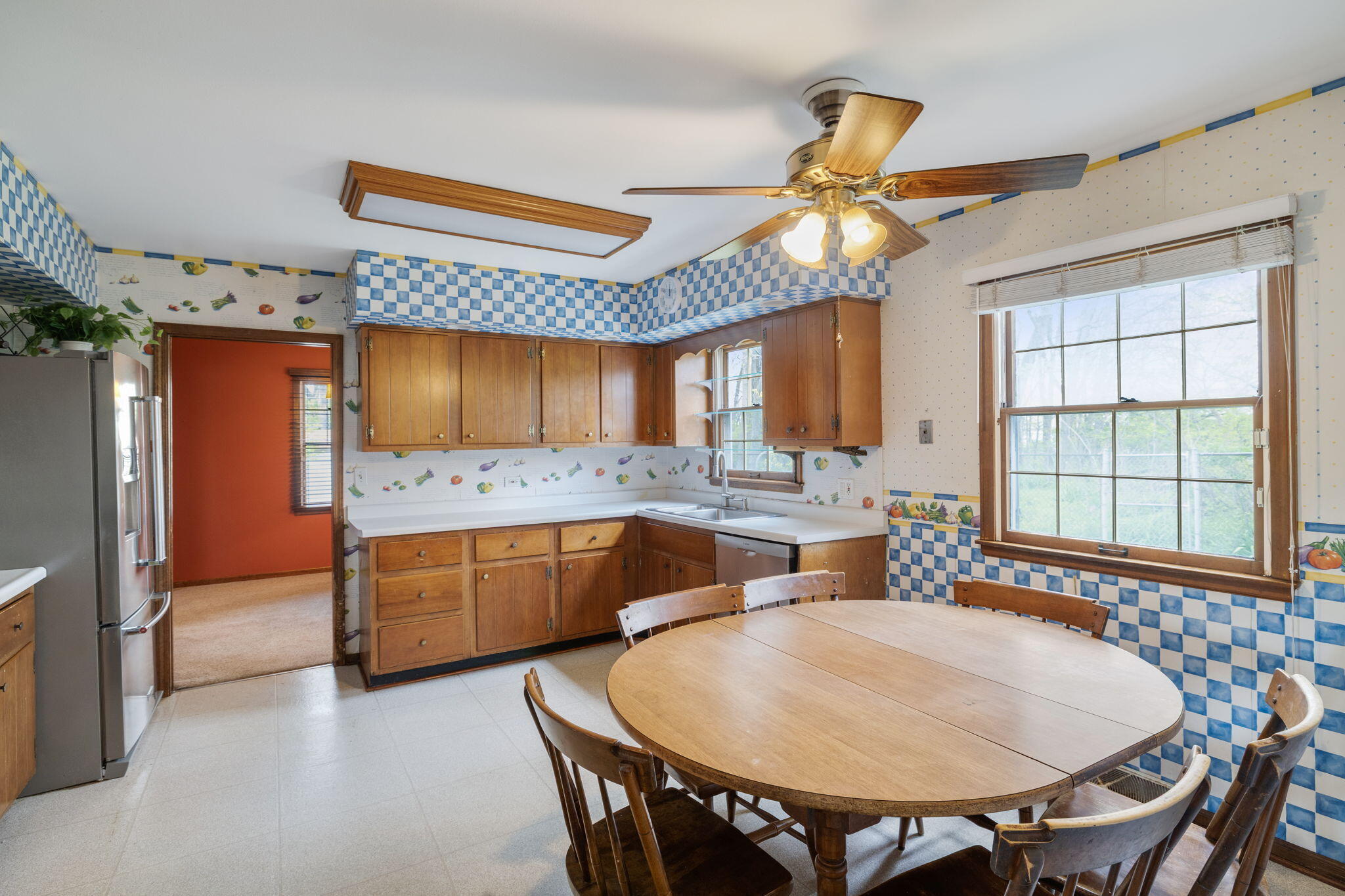 218 West 38th Court Griffith, IN 46319 - Photo 8 of 23 a kitchen with a table and chairs