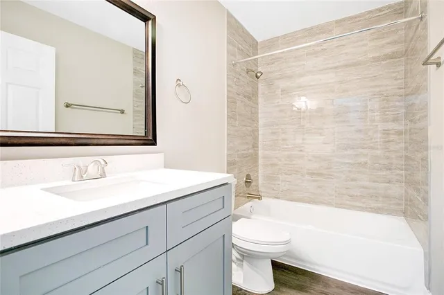 a bathroom with a sink a toilet and a bathtub