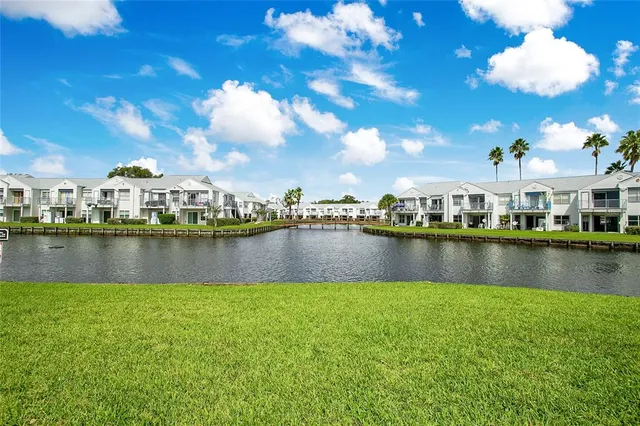 a view of a lake with a house in the background