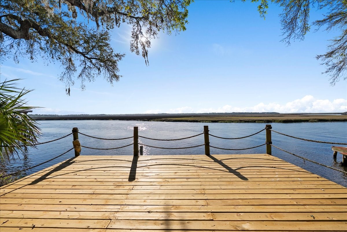 85316 Avant Road Yulee, FL 32097 - Photo 58 of 62 a wooden bench sitting on top of a wooden deck