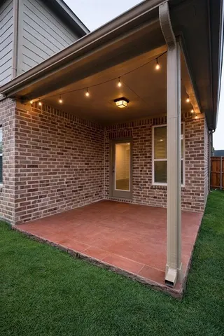 a view of a patio with table and chairs potted plants with wooden floor and fence