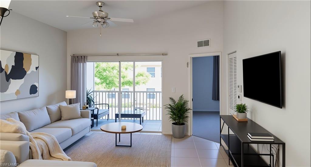 4128 Bellasol Circle, Unit 1423 Fort Myers, FL 33916 - Photo 1 of 6 a living room with furniture a flat screen tv and a large window