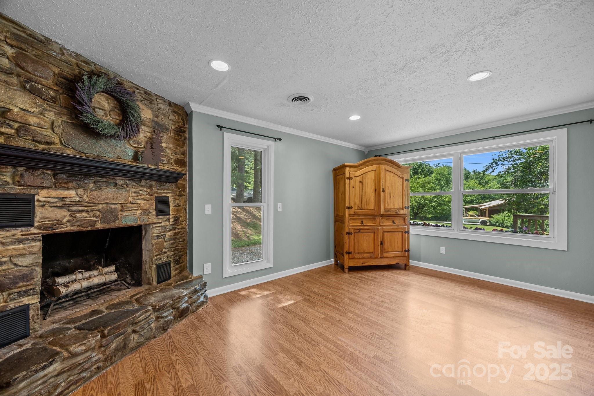 64 Christopher Lane Sylva, NC 28779 - Photo 16 of 31 an empty room with furniture wooden floor fireplace and windows
